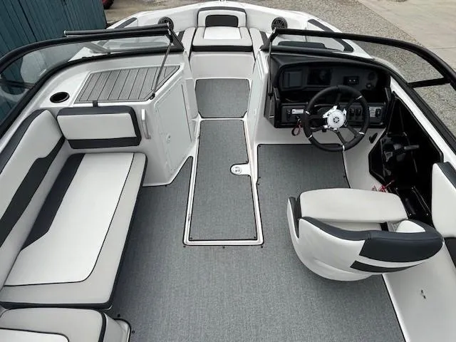 Slide: The Image of 2022 Yamaha Boats AR195 interior with sleek seating and modern dashboard design. - 17