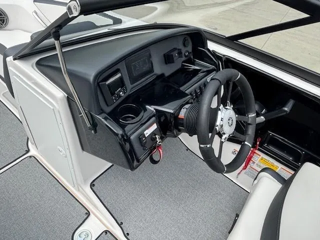 Slide: The Image of 2022 Yamaha Boats AR195 dashboard with steering wheel and controls. - 19
