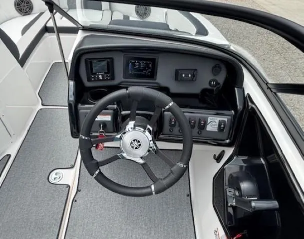Slide: The Image of 2022 Yamaha Boats AR195 dashboard with steering wheel and control panel. - 20