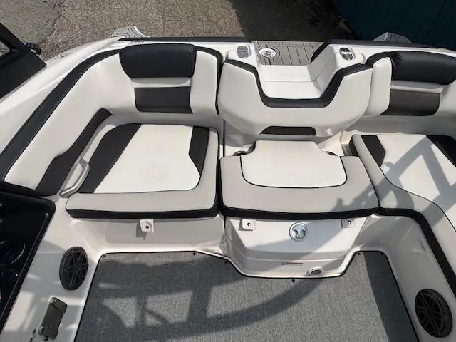 Slide: The Image of 2022 Yamaha Boats AR195 interior seating with black and white upholstery. - 27