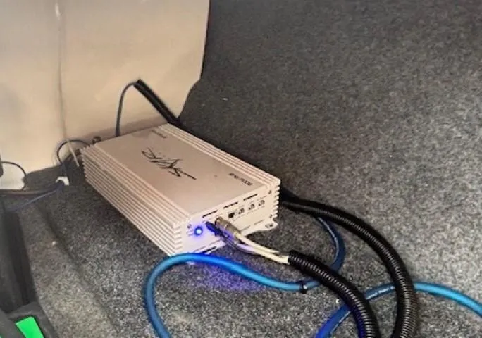 Slide: The Image of Amplifier installed in a 2022 Yamaha Boats AR195, with connected cables. - 35