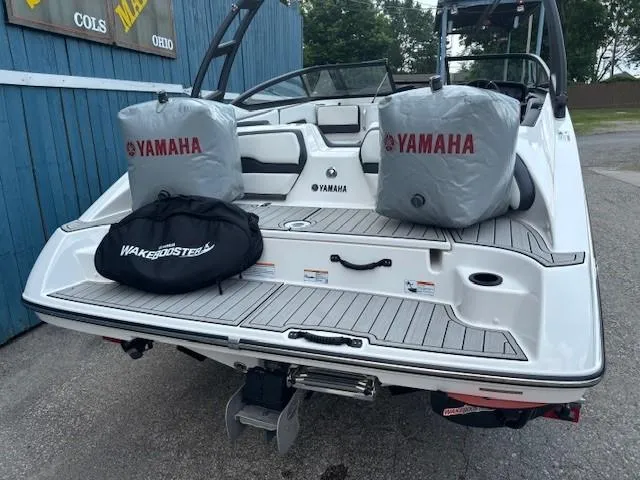 Slide: The Image of 2022 Yamaha AR195 boat with protective covers and wakeboard gear on deck. - 7
