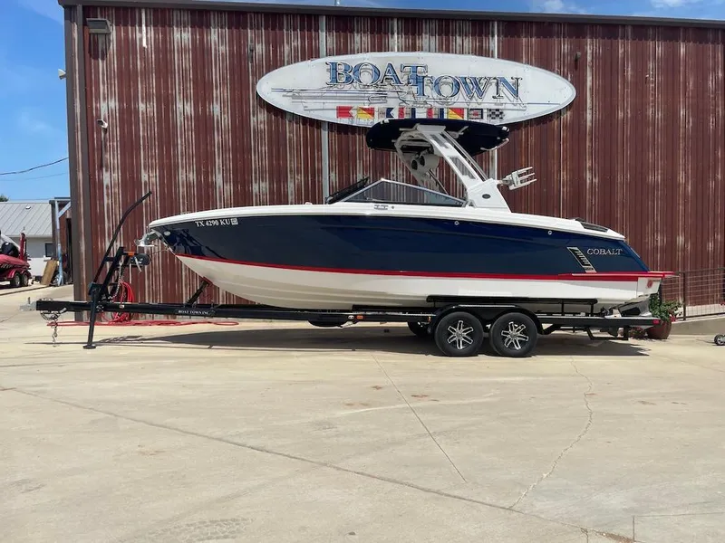 Slide: The Image of 2023 Cobalt R8 Surf boat on trailer at Boat Town dealership. - 0