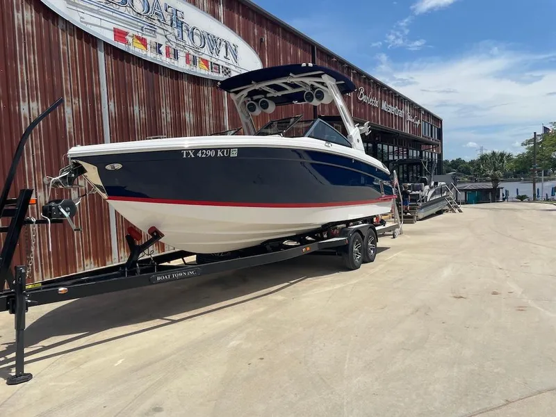 Slide: The Image of 2023 Cobalt R8 Surf boat on trailer outside Boat Town dealership. - 1