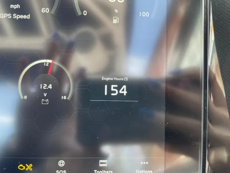 Slide: The Image of Dashboard display of 2023 Cobalt R8 Surf showing 154 engine hours and 12.4 volts. - 10