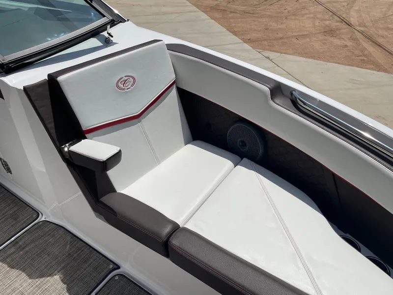 Slide: The Image of 2023 Cobalt R8 Surf boat interior with white and black seating, red accents. - 13
