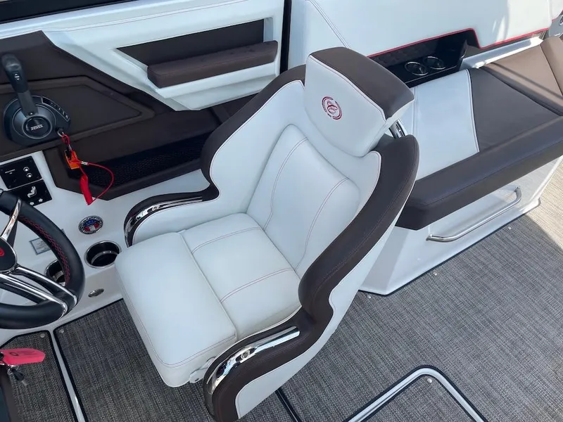 Slide: The Image of Captain's chair in 2023 Cobalt R8 Surf boat, featuring sleek design and modern controls. - 16