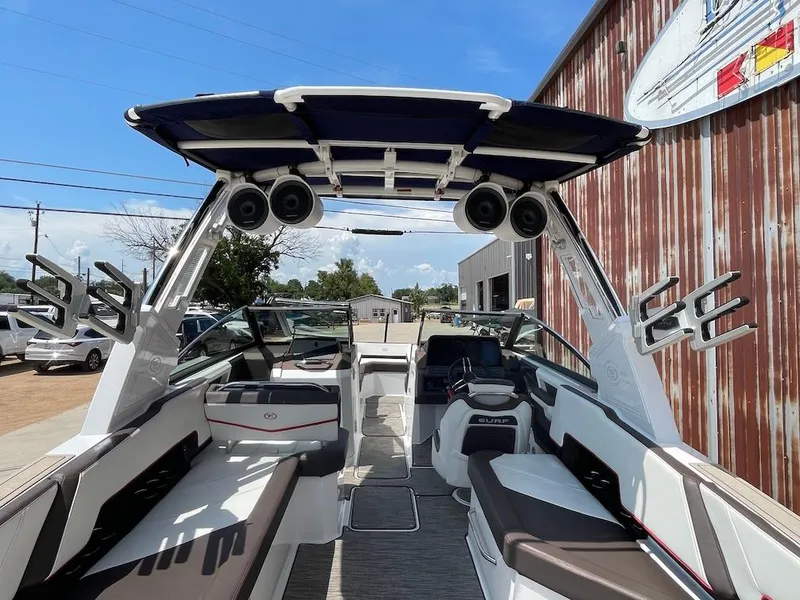 Slide: The Image of 2023 Cobalt R8 Surf boat interior with seating, speakers, and modern design. - 5