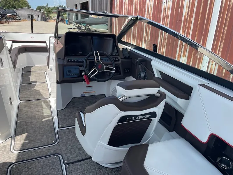 Slide: The Image of 2023 Cobalt R8 Surf boat interior with modern dashboard and steering wheel. - 8