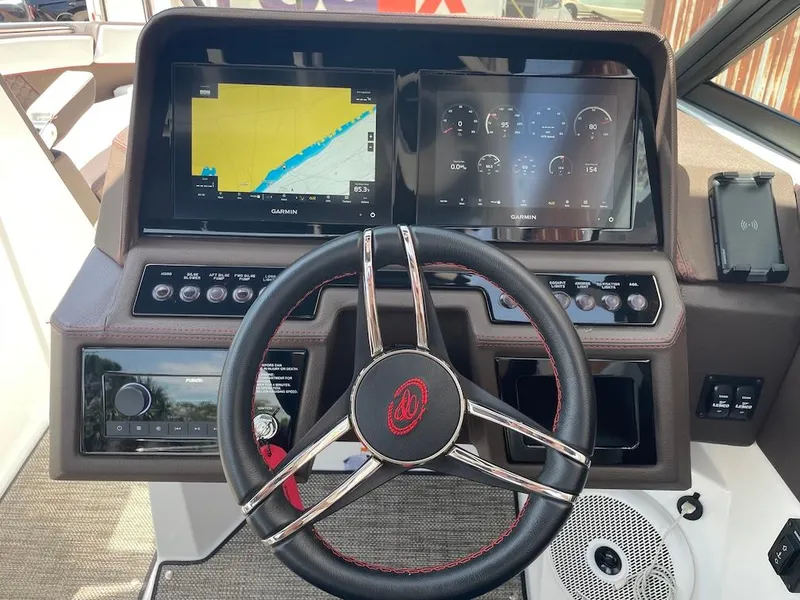 Slide: The Image of 2023 Cobalt R8 Surf dashboard with Garmin displays and leather steering wheel. - 9