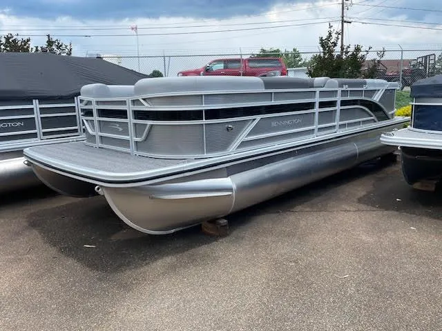 The Image of 2024 Bennington 22 SLSR Cruise pontoon boat displayed outdoors. - 1