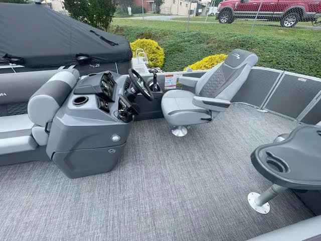 Slide: The Image of 2024 Bennington 22 SLSR Cruise boat interior with modern seating and steering console. - 6