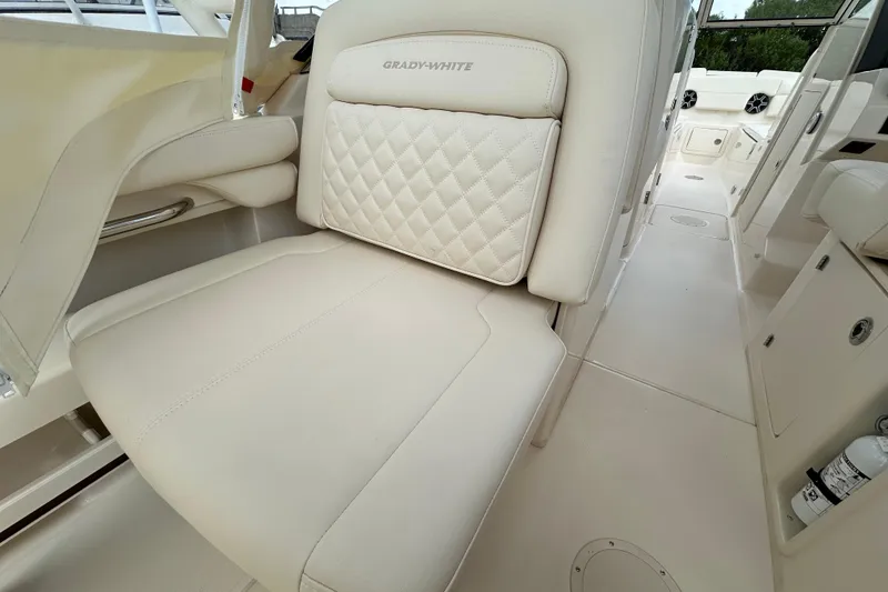 Slide: The Image of 2026 Grady-White Freedom 275 boat interior with luxurious seating and elegant design. - 13
