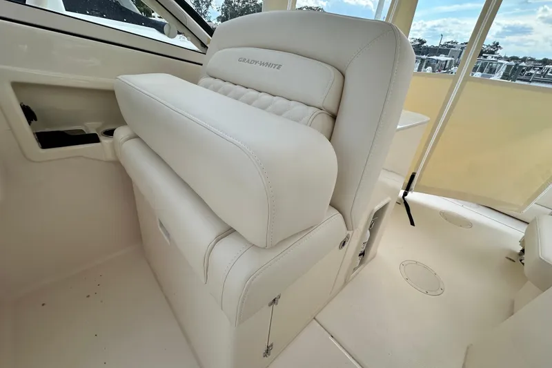 Slide: The Image of 2026 Grady-White Freedom 275 boat interior with luxurious white seating. - 16