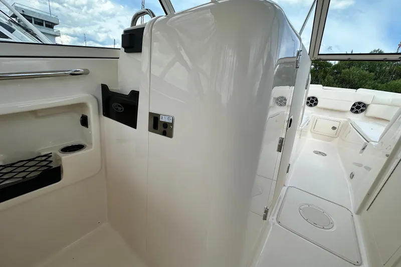 Slide: The Image of 2026 Grady-White Freedom 275 boat interior, featuring sleek design and modern amenities. - 19