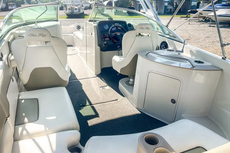 Slide: The Image of 2007 Sea Ray 260 Sundeck interior with seating, helm, and sink area. - 10