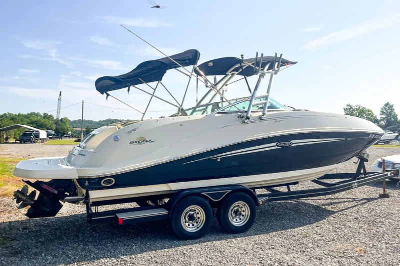 Slide: The Image of 2007 Sea Ray 260 Sundeck boat on trailer, parked outdoors. - 3