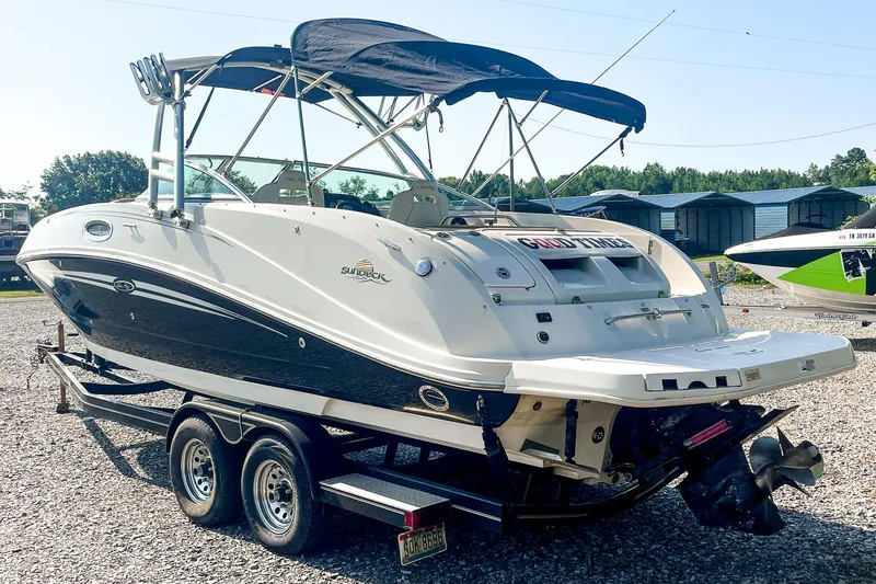 Slide: The Image of 2007 Sea Ray 260 Sundeck boat on trailer, featuring sleek design and canopy. - 6