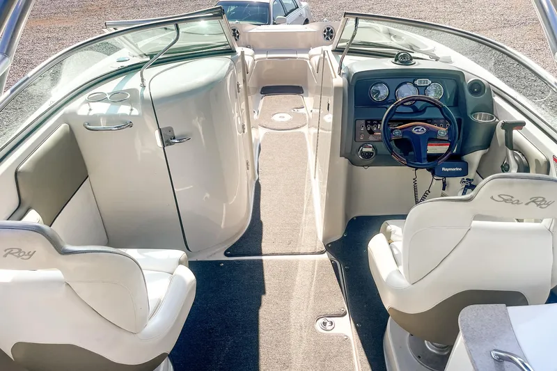 Slide: The Image of 2007 Sea Ray 260 Sundeck interior with steering wheel, seating, and dashboard controls. - 8
