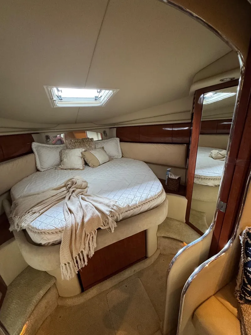 Slide: The Image of Luxurious cabin interior of 2010 Sea Ray 360DA yacht with cozy bed and skylight. - 11