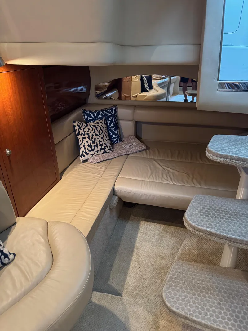 Slide: The Image of Luxurious interior of 2010 Sea Ray 360DA yacht with beige seating and decorative pillows. - 16