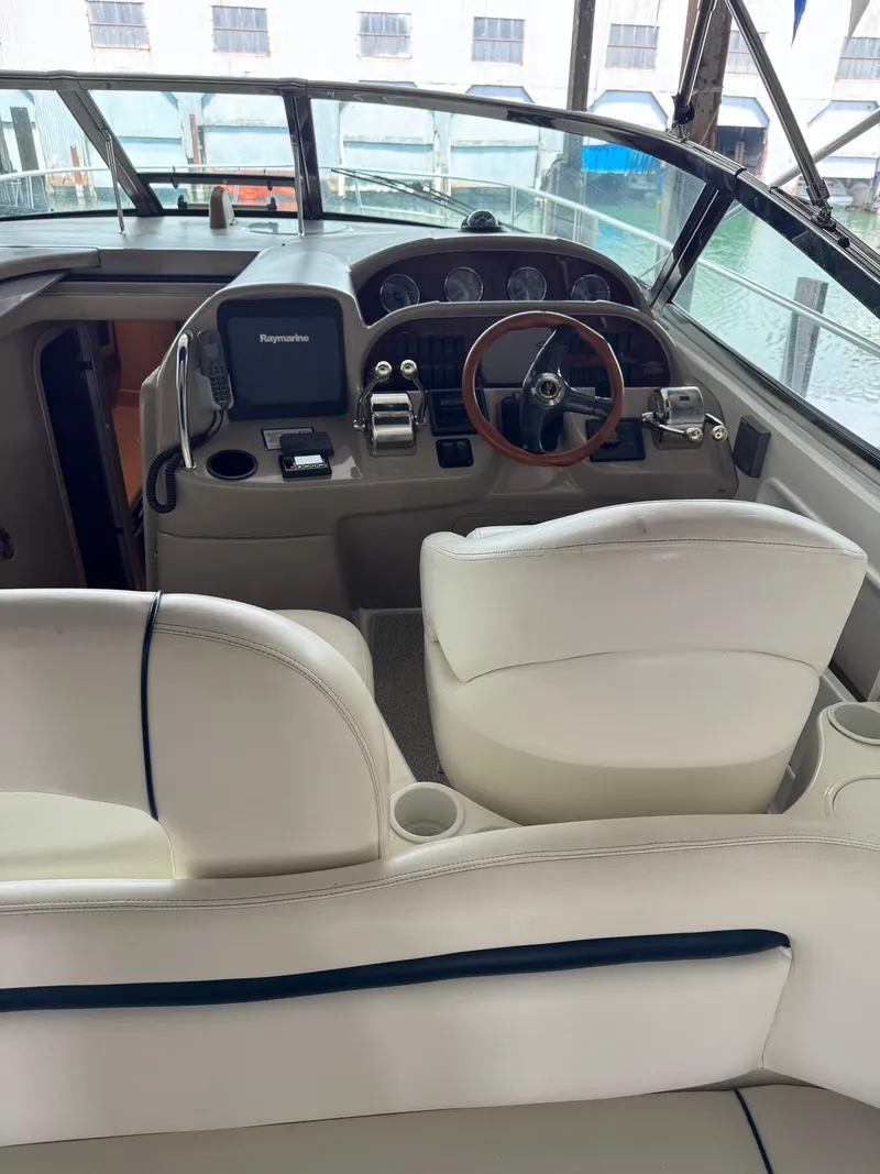 Slide: The Image of Interior view of 2010 Sea Ray 360DA boat cockpit with steering wheel and controls. - 23
