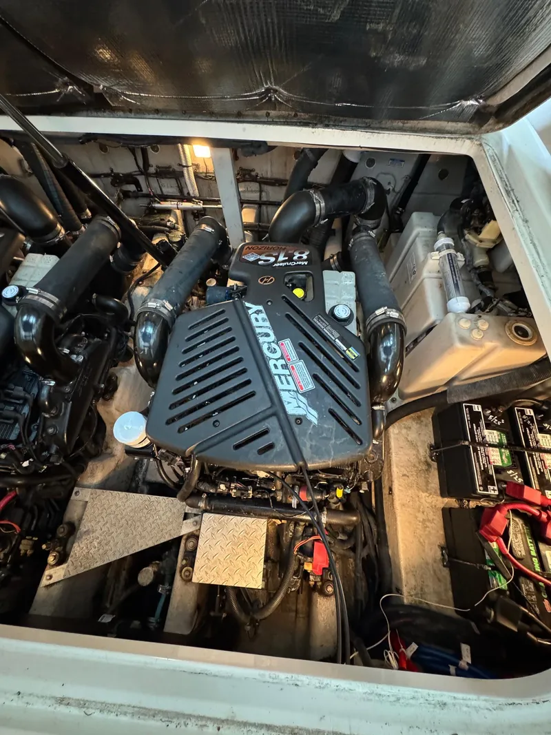 Slide: The Image of Engine compartment of a 2010 Sea Ray 360DA with MerCruiser components and batteries. - 27