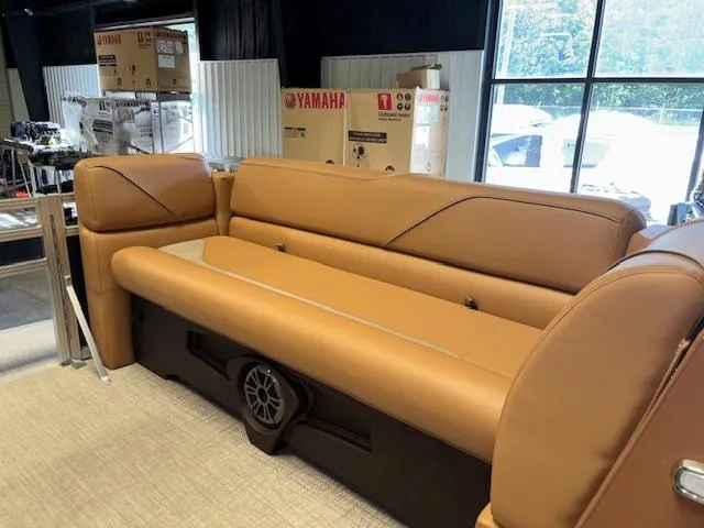 Slide: The Image of 2025 Tahoe Pontoon SP 2180 CR interior with tan seating and speaker system. - 18