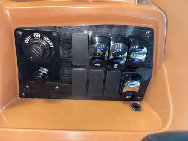 Slide: The Image of Control panel of 2025 Tahoe Pontoon SP 2180 CR with switches and ignition. - 23
