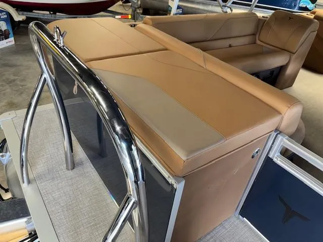 Slide: The Image of 2025 Tahoe Pontoon SP 2180 CR with tan seating and stainless steel railing. - 26