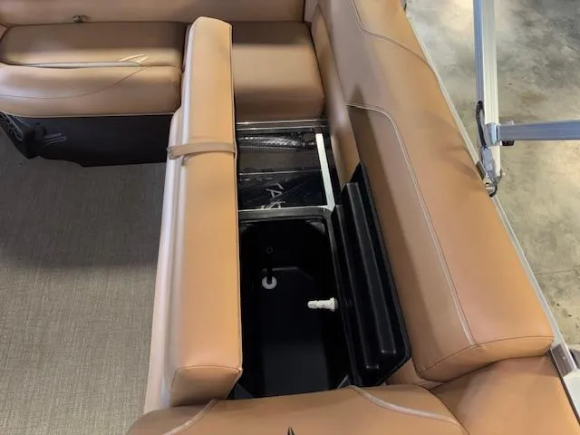 Slide: The Image of 2025 Tahoe Pontoon SP 2180 CR with tan seating and built-in storage compartment. - 30