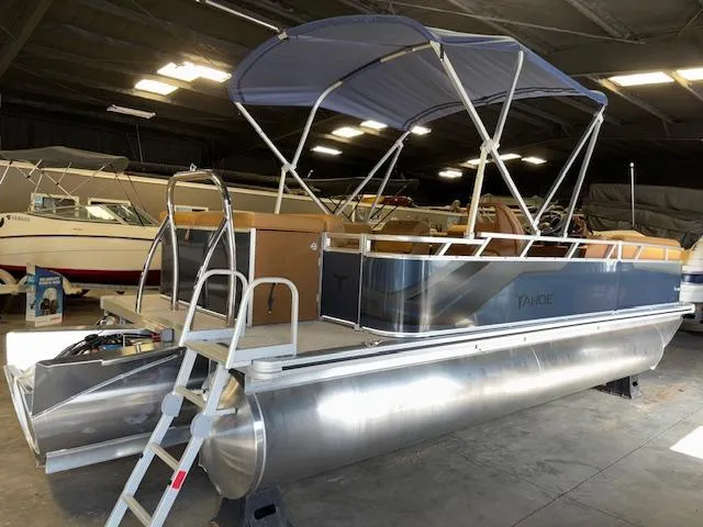 Slide: The Image of 2025 Tahoe Pontoon SP 2180 CR with canopy in a showroom. - 8