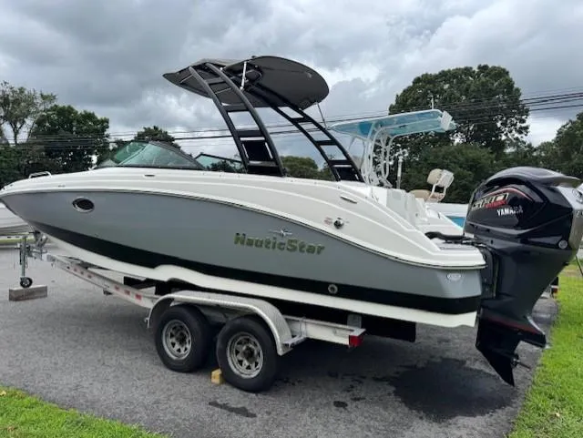 Slide: The Image of 2023 NauticStar 243 DC boat on trailer with Yamaha outboard motor. - 5