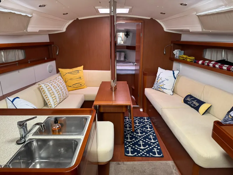 Slide: The Image of Interior of 2014 Beneteau 37 sailboat with cozy seating and nautical decor. - 17