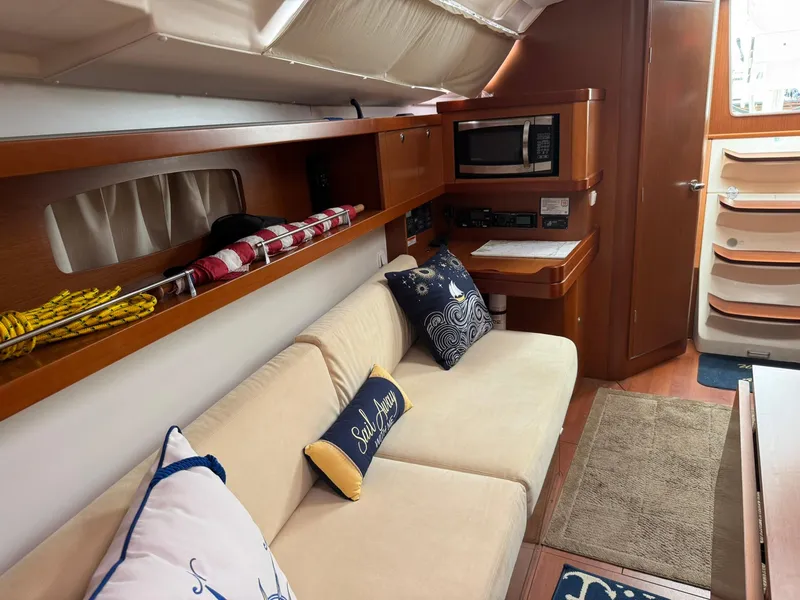 Slide: The Image of Interior of 2014 Beneteau 37 yacht with cozy seating, nautical decor, and modern amenities. - 22