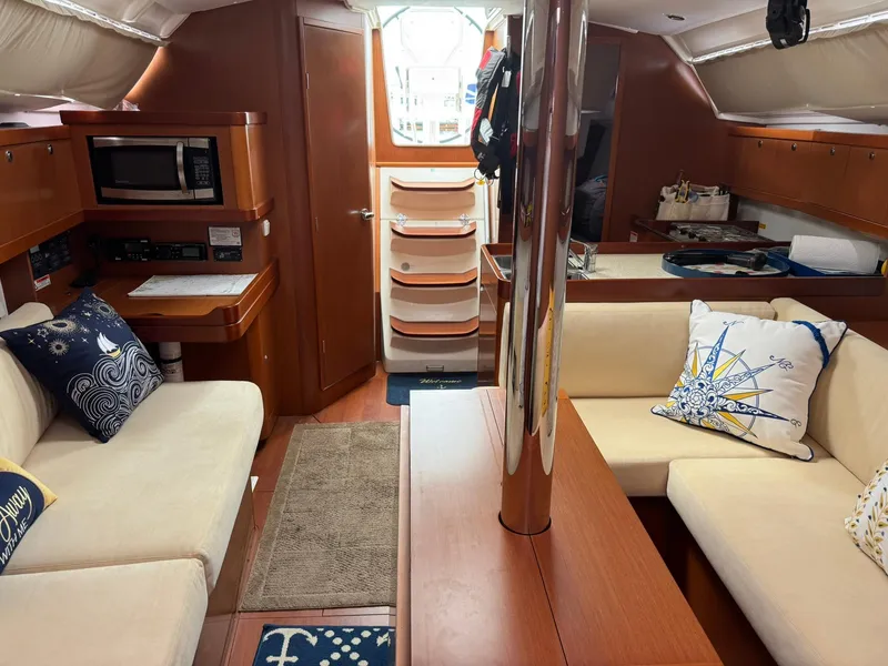 Slide: The Image of Interior of 2014 Beneteau 37 sailboat with cozy seating and nautical decor. - 23
