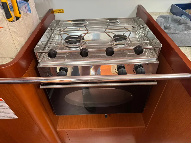 Slide: The Image of Stove and oven in 2014 Beneteau 37 yacht galley featuring stainless steel finish. - 25