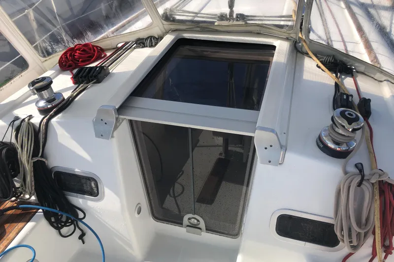 Slide: The Image of Cockpit of 2014 Beneteau 37 sailboat with ropes and winches visible. - 31