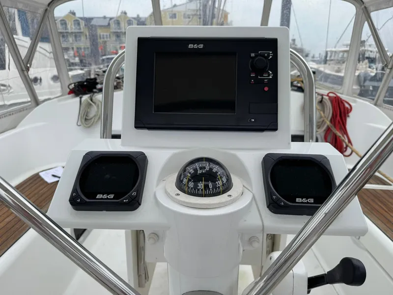 Slide: The Image of Cockpit of 2014 Beneteau 37 sailboat with navigation instruments and compass. - 7