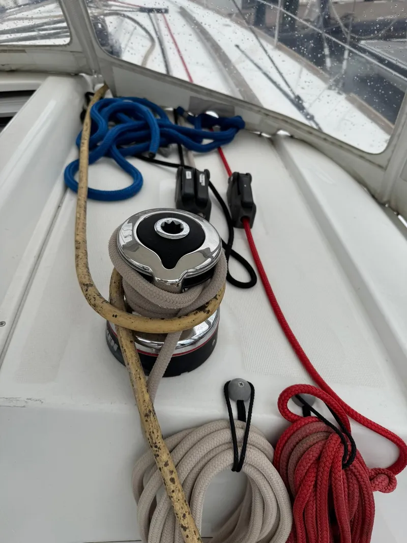 Slide: The Image of Winch and ropes on a 2014 Beneteau 37 sailboat deck. - 8