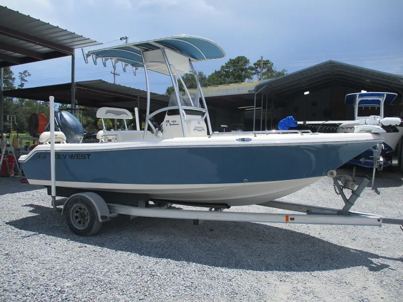 Slide: The Image of 2008 Key West 186 Sportsmen boat on trailer, parked outdoors. - 0