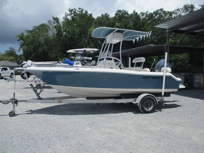 Slide: The Image of 2008 Key West 186 Sportsmen boat on trailer, parked outdoors. - 1