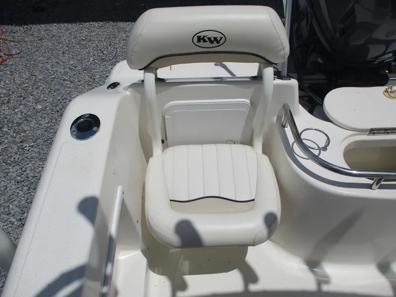 Slide: The Image of White seat on 2008 Key West 186 Sportsmen boat, featuring KW logo and cup holder. - 10