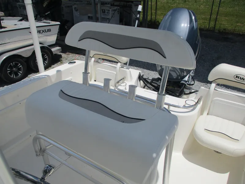 Slide: The Image of 2008 Key West 186 Sportsmen boat interior with seating and motor. - 12