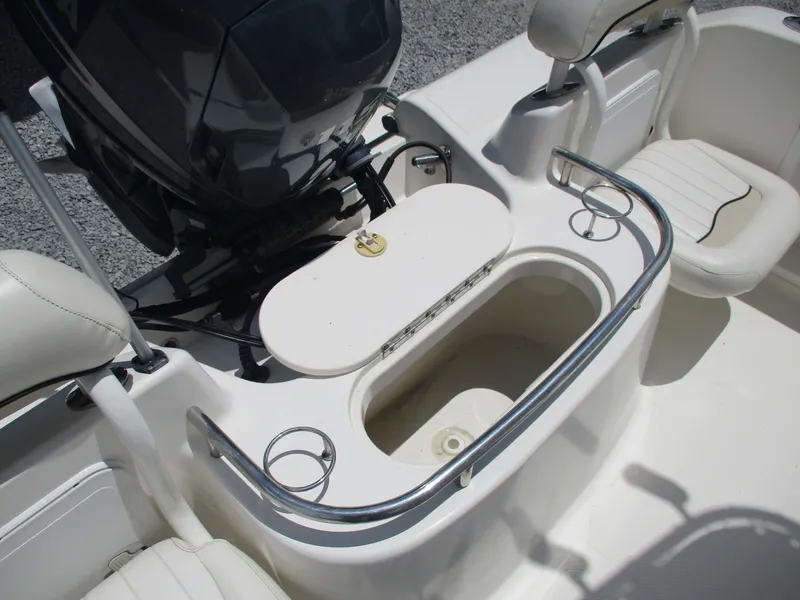 Slide: The Image of 2008 Key West 186 Sportsmen boat interior with seating and engine view. - 14