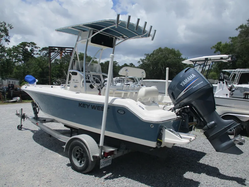 Slide: The Image of 2008 Key West 186 Sportsmen boat with Yamaha engine on trailer, parked outdoors. - 3