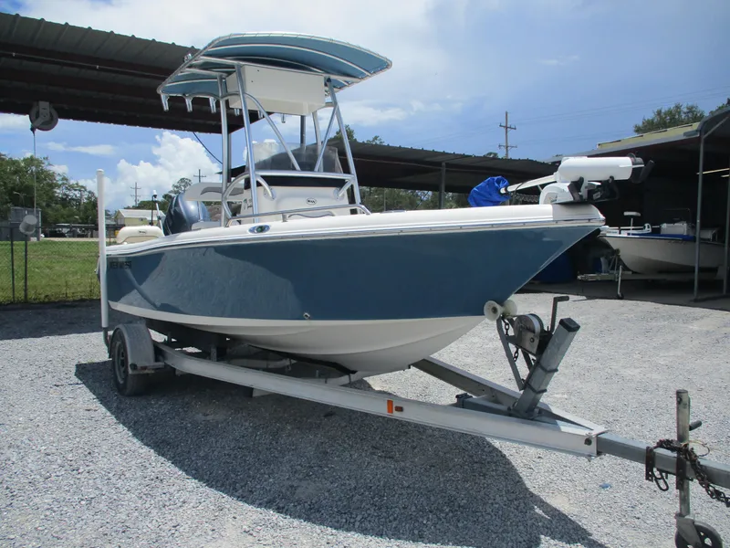 Slide: The Image of 2008 Key West 186 Sportsmen boat on trailer, parked outdoors under a canopy. - 4
