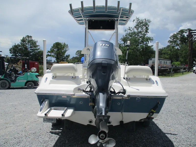 Slide: The Image of 2008 Key West 186 Sportsmen boat with Yamaha 115 engine, parked on gravel. - 5