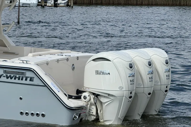 Slide: The Image of 2026 Grady-White Freedom 345 boat with triple Yamaha 350 V6 engines on water. - 19