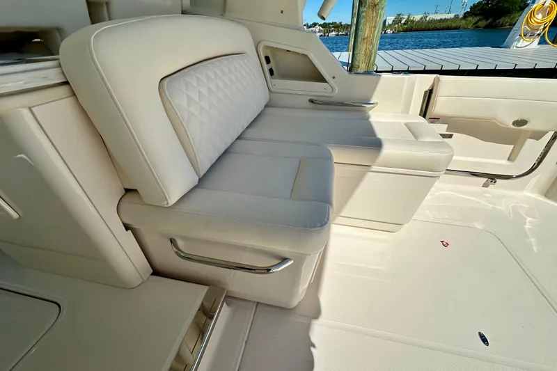 Slide: The Image of Luxury seating on 2026 Grady-White Freedom 345 boat, featuring elegant white upholstery. - 38